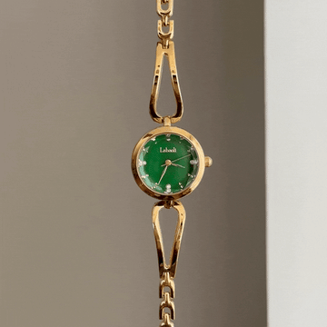 Gilded Elegance: Green Round Dial Watch with Gold Bezel & Bracelet