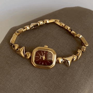 Avant-Garde Geometry: Bold Red Rectangular Dial Watch with Gold Bezel & Geometric Triangle Bracelet