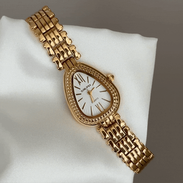 Mystic Glamour: White Serpenti Dial Watch with Gold-Tone Stainless Steel Bracelet