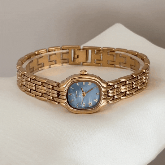 Modern Contrast: Blue Round Dial Watch with Gold Bezel & Gold Alloy Strap