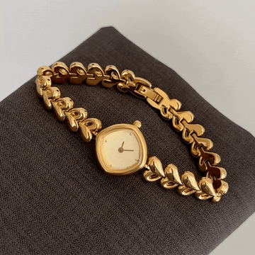 Modern Glamour: Geometric Gold Rhombus Dial Watch with Gold-Tone Leaf-Designed Bracelet