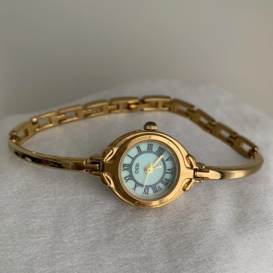 Mini Golden Charm Timepiece: Green Mother-of-Pearl Round Bracelet Watch