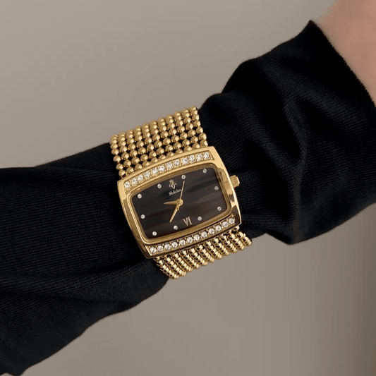 Bold Luxury: Black Elongated Rectangular Dial Watch with Gold Diamond Bezel & Wide Stainless Steel Bracelet