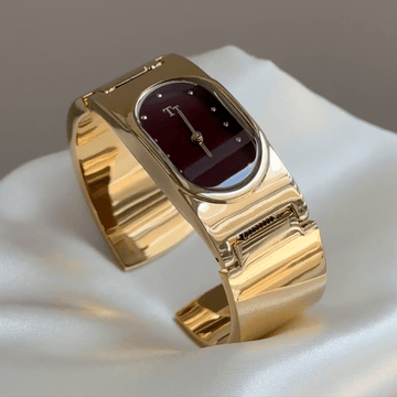 Vintage Polished Gold Wide Cuff Watch with Burgundy Red Oval Dial