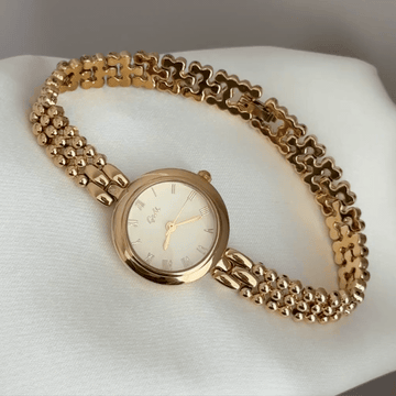 Classic Luxe: Gold Round Dial Watch with Matching Bezel & Gold-Tone Steel Bracelet