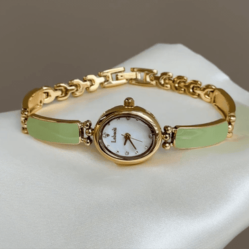 Artistic Flair：White Oval Dial Watch – Gold Oval Case & Green Stainless Steel Band Quartz