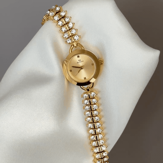 Diamond Sparkle: Gold Round Dial Watch with Gold Bezel & Diamond-Set Gold Chain Bracelet