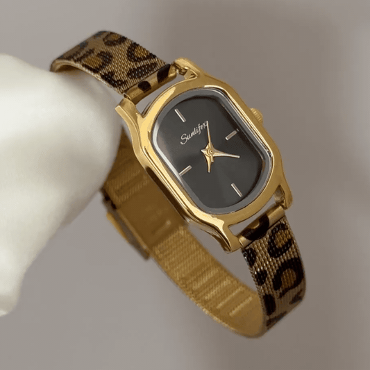 Leopard Edge: Black Oval Dial Watch with Gold Oval Bezel & Brown Leopard Print Steel Bracelet