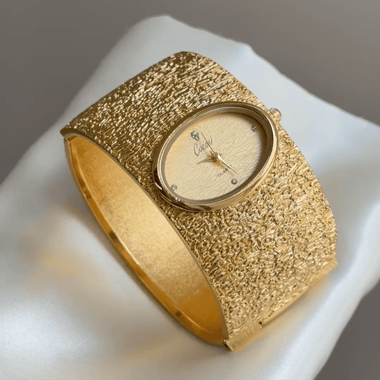 Vintage Textured Gold Wide Cuff Watch with Oval Wave-Pattern Dial