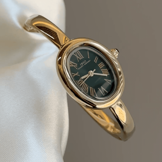 Petite Oval Charm：Black Oval Dial Watch – Gold Oval Bezel & Gold Stainless Steel Cuff Bangle