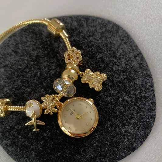Bear & Plane Timepiece: Gold Bracelet Zirconia Watch