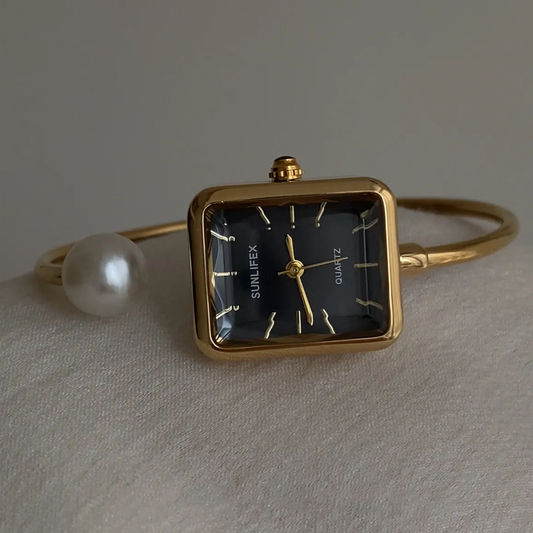 Noir Pearl – Black & Gold Bangle Watch with Pearl Accents