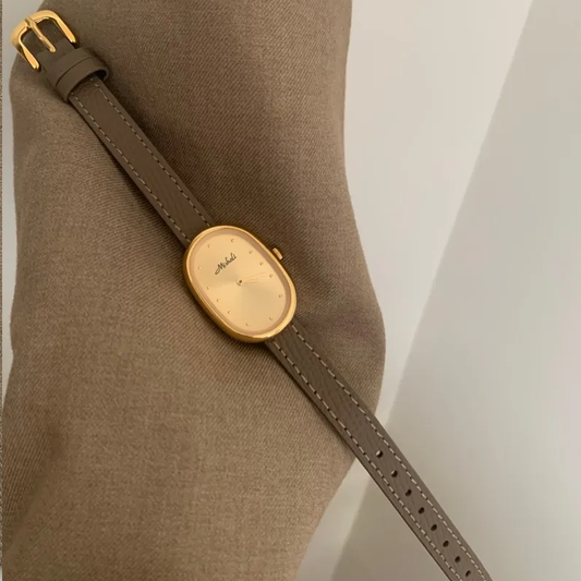 Elephant Gray Timepiece: Gold-Toned Oval Dial Quartz Watch