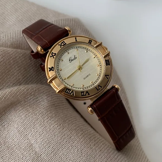 Vintage Charm Timepiece: Brown Leather Gold Case Roman Dial Watch