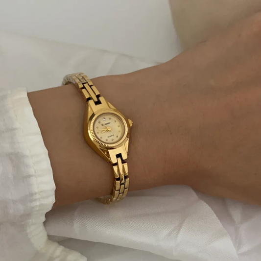 French-Inspired Gold Bracelet with Petite Round Dial: Lady's Quartz Watch