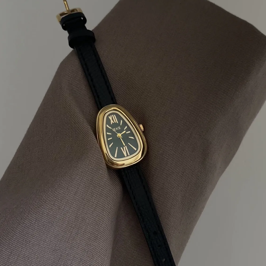 Vintage Charm: Black Leather & Gold Case Green Snake Dial Quartz Watch