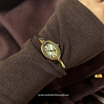 Aura Curve – Gold Bangle Watch with Sculpted Oval Dial