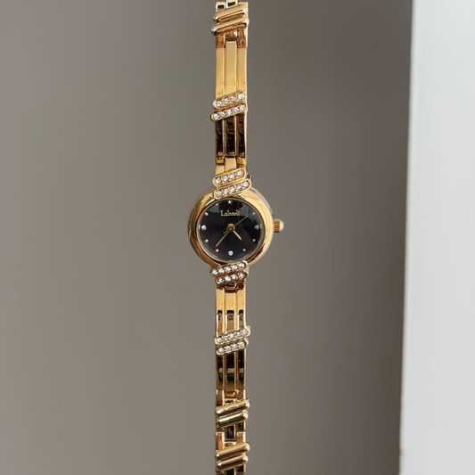 Sophistication Contrast: Black Round Dial Watch with Gold Round Bezel & Gold Stainless Steel Bracelet