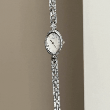 Modern Soft Elegant: Defined by Subtle Curves – White Oval Dial & Slim Silver Alloy Bracelet
