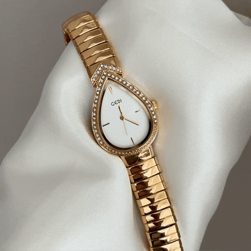 Feminine Artistry: White Teardrop Serpenti Dial with Gold Diamond Bezel & Strap