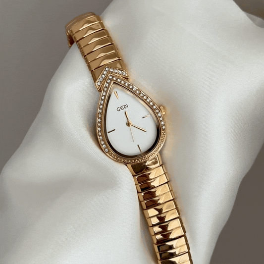 Feminine Artistry: White Teardrop Serpenti Dial with Gold Diamond Bezel & Strap