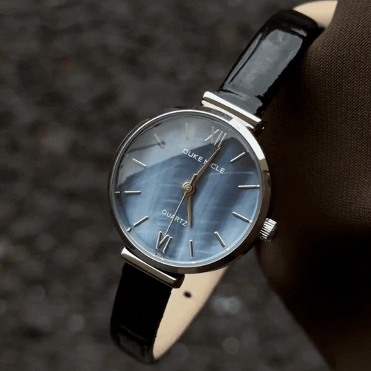 Vintage Elegance: Iridescent Blue Mother-of-Pearl Round Dial Watch with Silver Bezel & Black Leather Strap