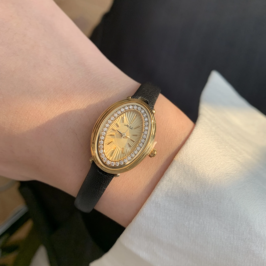 Luna Éclat – Women’s Gold Crystal Oval Dial Quartz Watch with Black Leather Strap