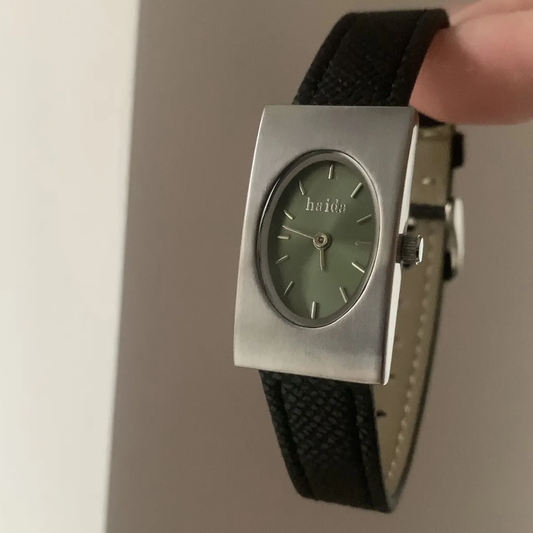 Vintage Green Timepiece: Silver Case with Gemstone Green Dial