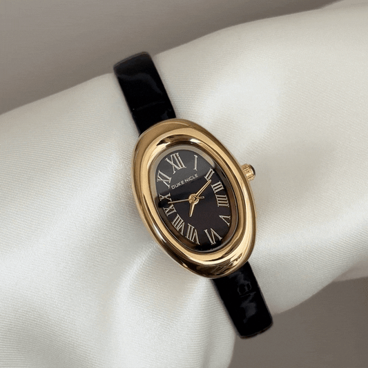 Elegant Edge: Black Oval Dial Watch with Gold Bezel & Black Leather Strap