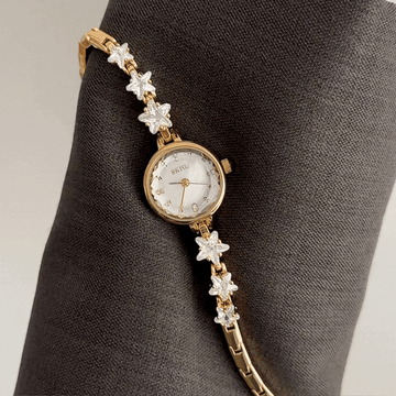 Versatile Shine: Starlight White Round Dial Watch with Gold Steel Bezel & Starry Bracele