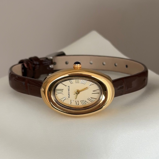 Retro Elegance: Gold Oval Dial Watch with Brown Leather Strap