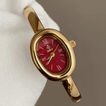 Rouge Éclat – Women’s Gold Bangle Quartz Watch with Red Tonneau Dial