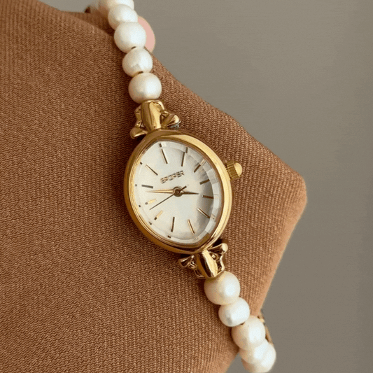 Sophisticated Oval Pearl & Gold Watch with White Dial and Dual-Tone Bracelet