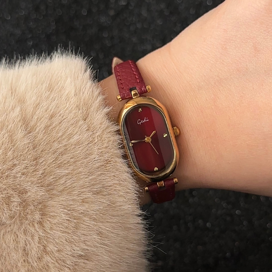Elongated Sophistication: Red Elongated Oval Dial Watch with Gold Bezel & Red Microfiber Strap