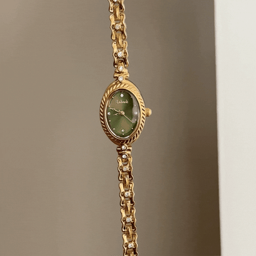 Luxe Shine: Green Oval Dial Watch with Gold Chain Bracelet