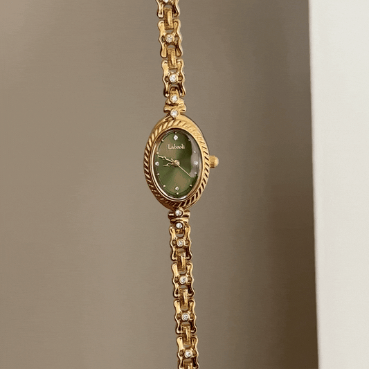Luxe Shine: Green Oval Dial Watch with Gold Chain Bracelet