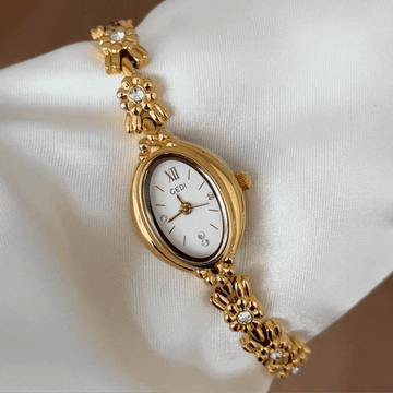Modern Elegance White Oval Dial Gold Diamond Bezel & Bracelet Watch