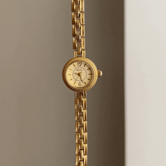 Women's Minimalist Gold Round Dial with Embossed Alloy Strap - Quartz