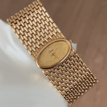 Women's Oval Gold Dial Watch with Wide Gold Alloy Bracelet - Quartz