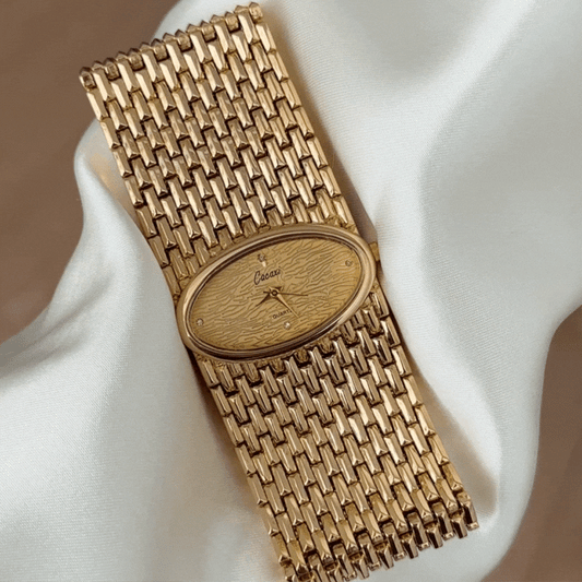 Women's Oval Gold Dial Watch with Wide Gold Alloy Bracelet - Quartz