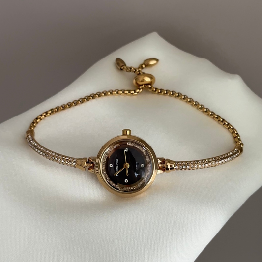 Expandable Ease: Black Round Dial Watch with Gold Bezel & Gold Expandable Chain Bracelet