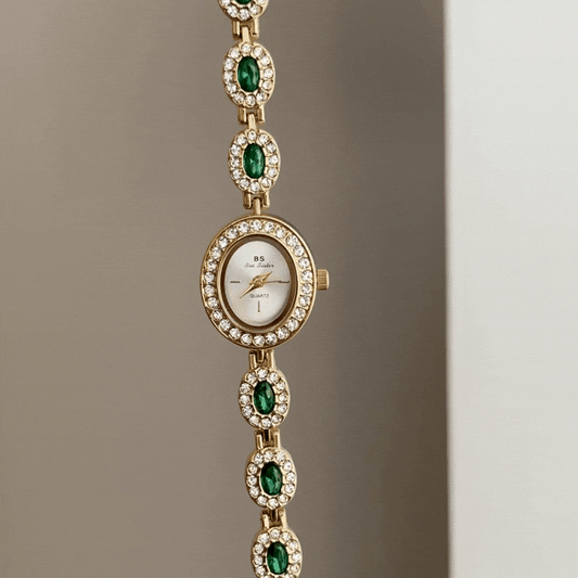 Glamour Elegant: White Oval Dial Watch with Gold Diamond Bezel & Emerald Gemstone Alloy Bracelet