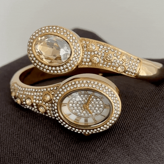 Serpent diamond accent gold watch close up