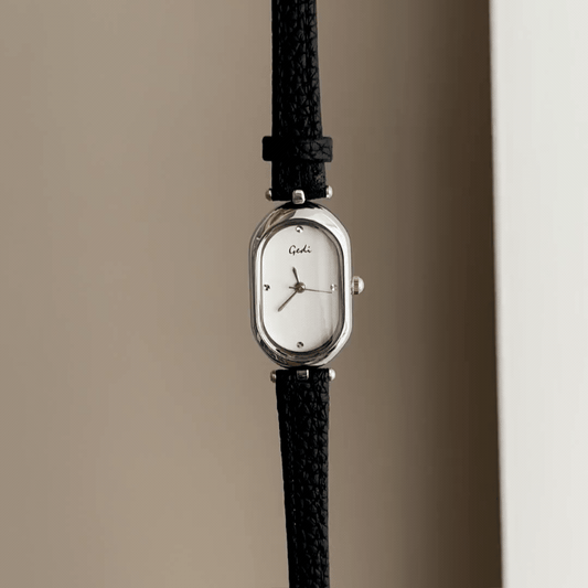 Modern Elegance: White Elongated Oval Dial Watch with Silver Bezel & Black Microfiber Leather Strap