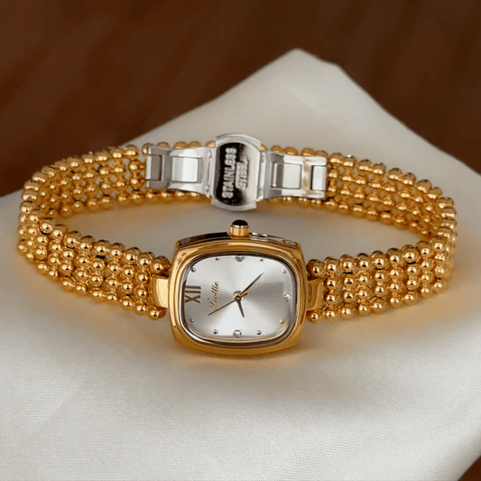 Classic Grace Elegant: White Oval Dial Watch with Gold Bezel & Stainless Steel Bracelet