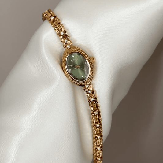 Luxe Shine: Green Oval Dial Watch with Gold Chain Bracelet