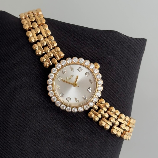 Luxury Elegant: White Round Dial Watch with Gold Gemstone Bezel & Stainless Steel Bracelet