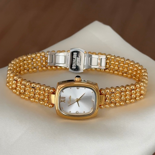 Classic Grace Elegant: White Oval Dial Watch with Gold Bezel & Stainless Steel Bracelet