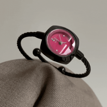 black bangle watch with red round dial