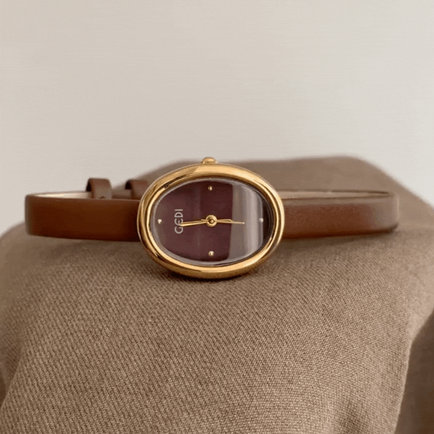 minimalist gold oval watch brown strap